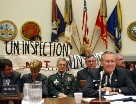 WASHINGTON, Demonstrators protesting 'UN inspections, not war,' behind R