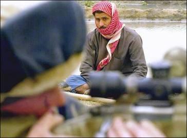 A US sniper takes aim, whilst a farmer looks on.