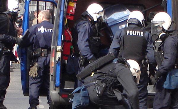 police wearing gas masks