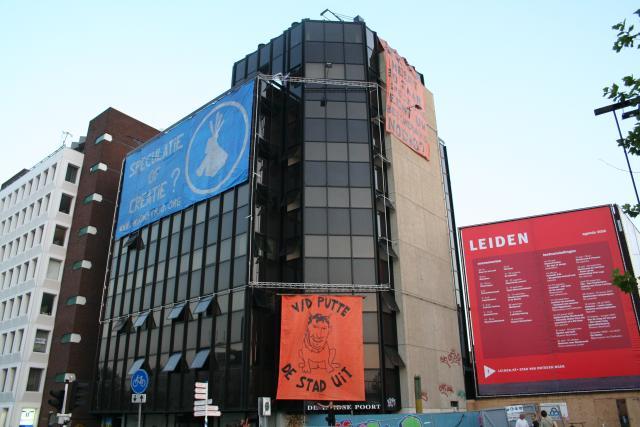 squatted building with all three banners