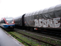 Uranium and passengers trains side by side.